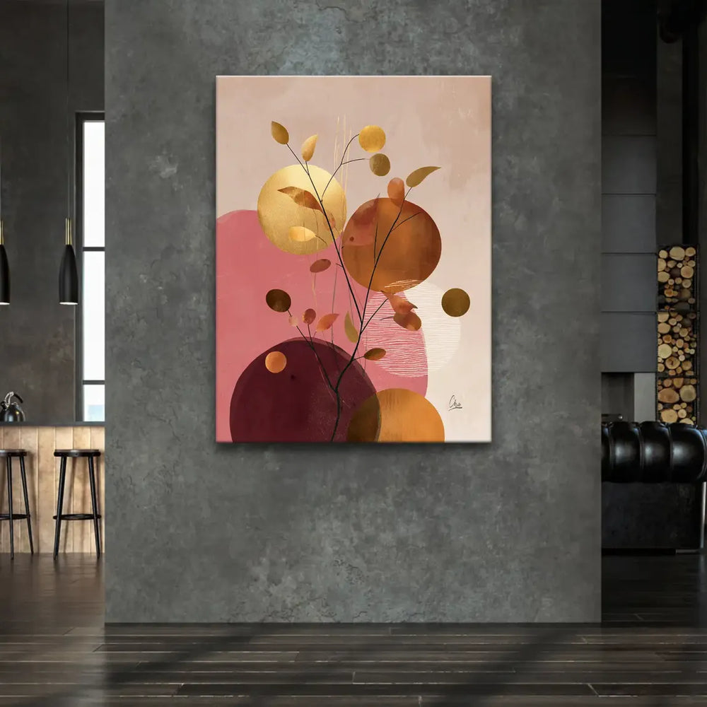 Delicate gold branches and warm-toned leaves in a botanical-inspired composition