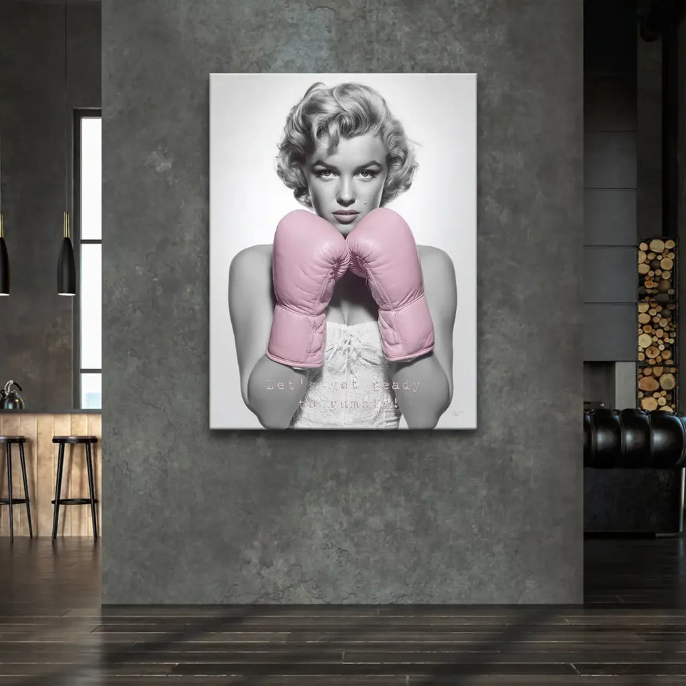 Centered Marilyn Monroe portrait on canvas, wearing pink boxing gloves.