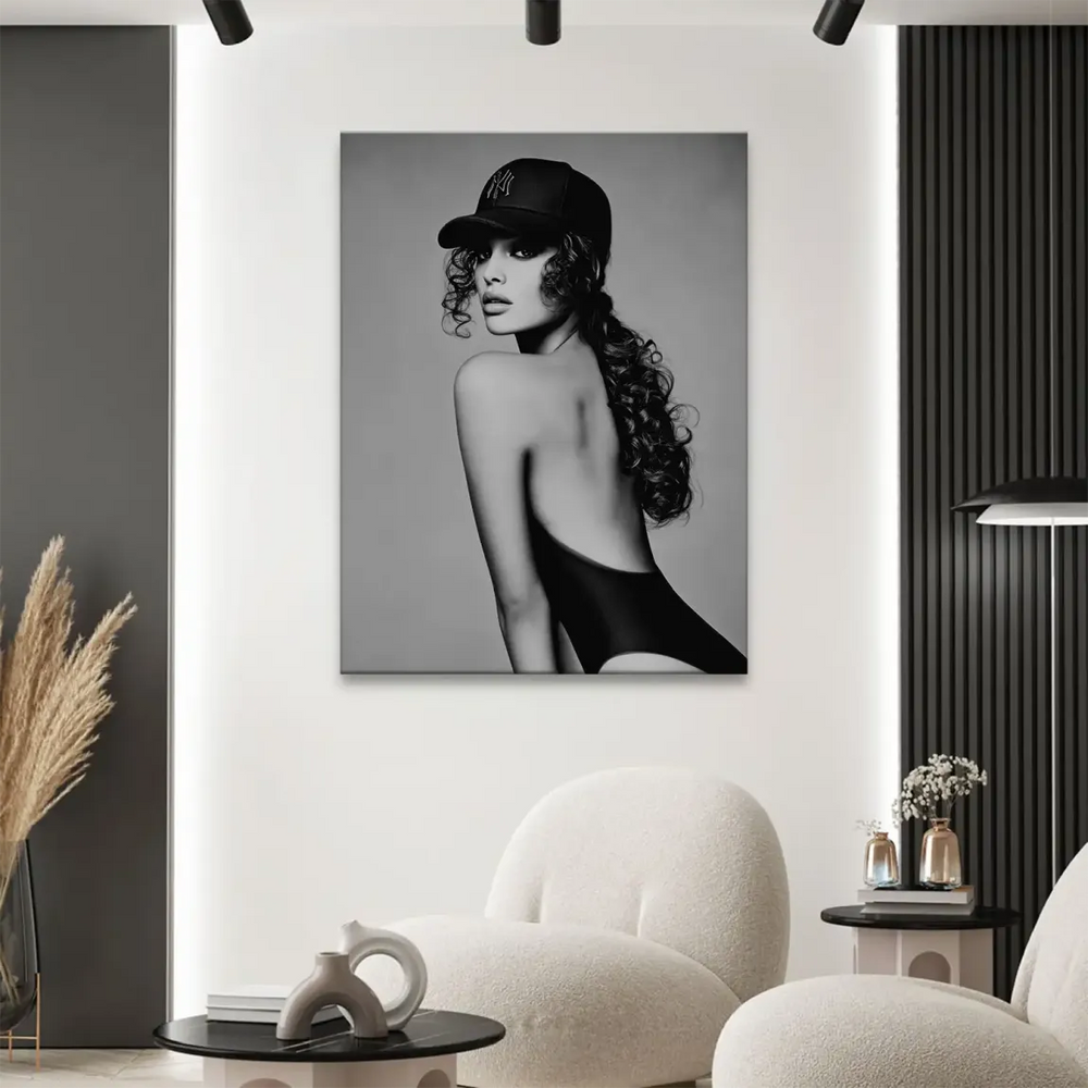Close-up of long curly hair and strong monochrome contrast in a fashion portrait