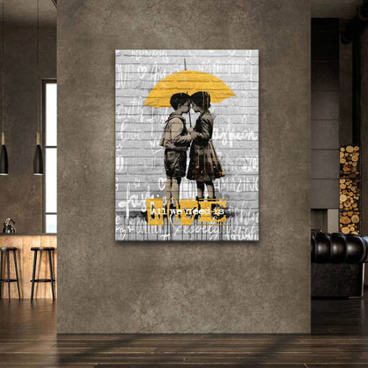 Close-up of the two children leaning in for a kiss under the umbrella in black and white