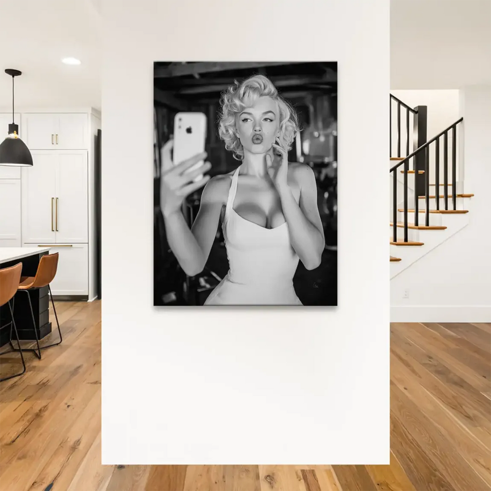 Monochrome wall art featuring a puckered-lip pose and blonde curls
