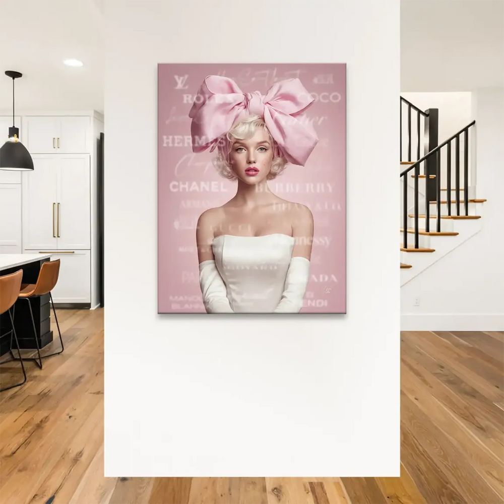 Blonde woman with blue eyes, fuchsia lips, wearing a pink bow, in a pink softly textured background with luxury brand motifs