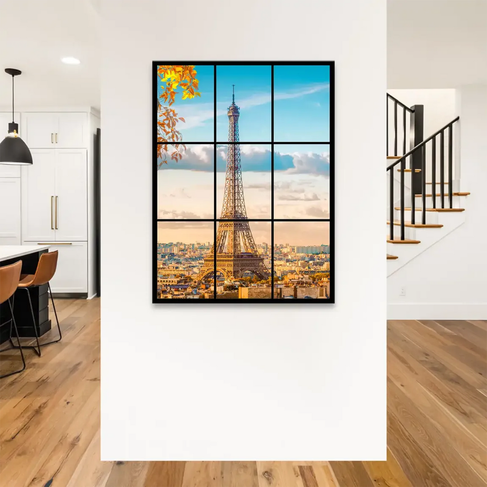 Paris skyline at sunrise with a clear blue sky and the Eiffel Tower as the focal point.