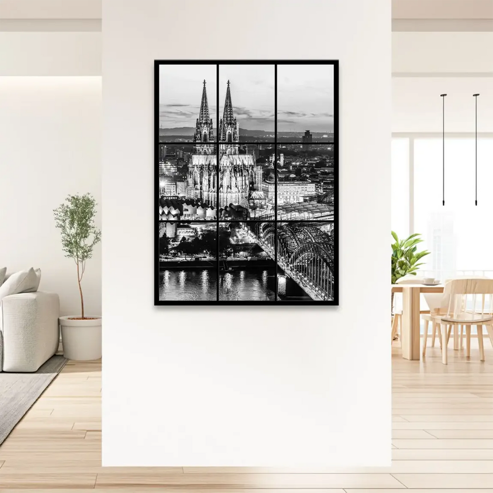 Hohenzollern Bridge arches gracefully over the reflective river.