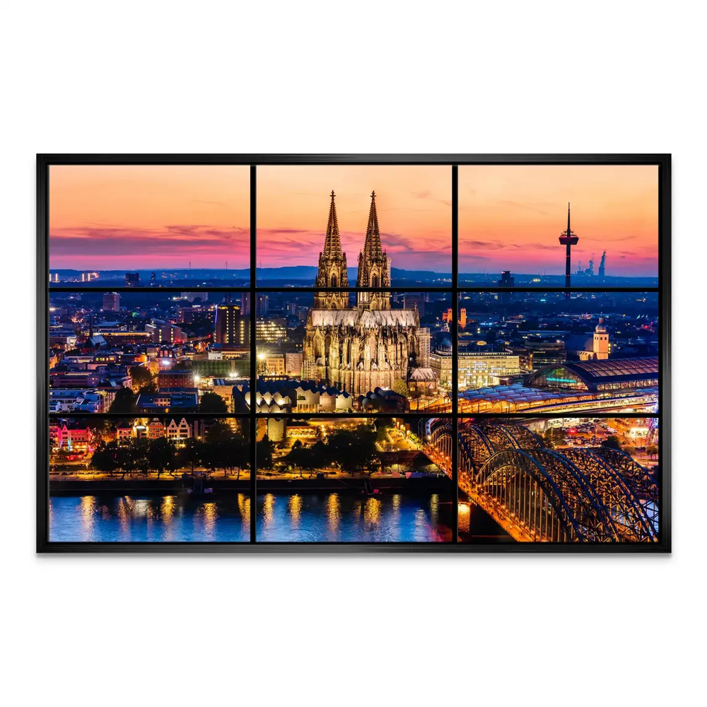 City lights reflected on the Rhine surrounding the Hohenzollern Bridge