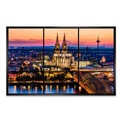 City lights reflected on the Rhine surrounding the Hohenzollern Bridge