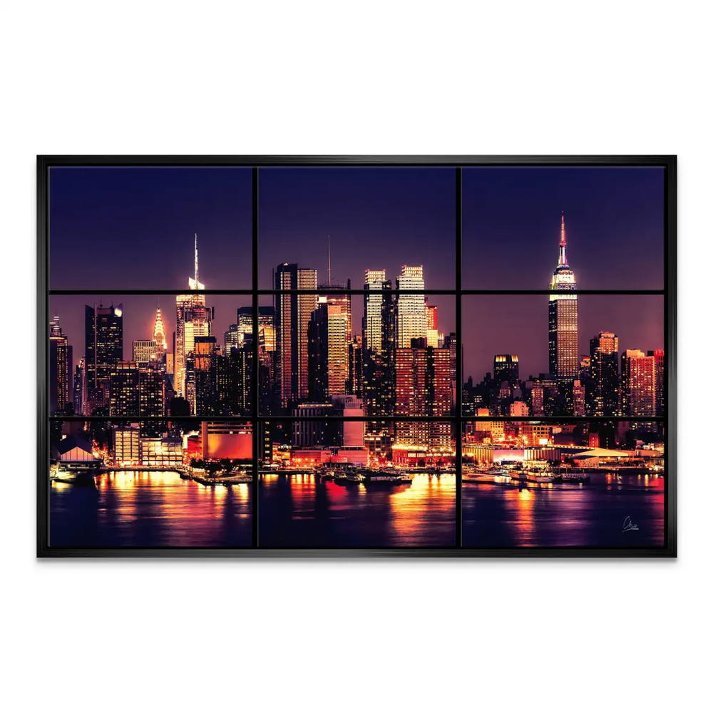 Skyscrapers bathed in purple and blue sky with orange city lights