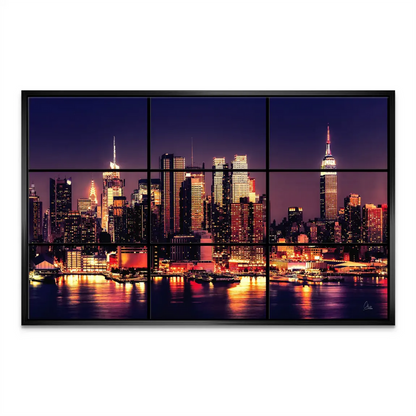 Skyscrapers bathed in purple and blue sky with orange city lights