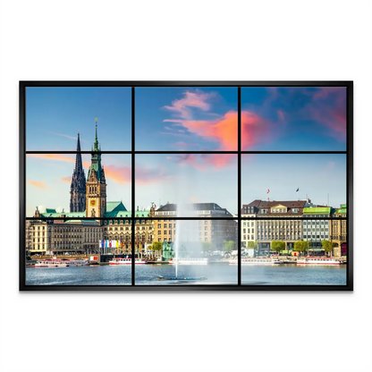 Vibrant Hamburg skyline at dusk with reflections on Inner Alster Lake.