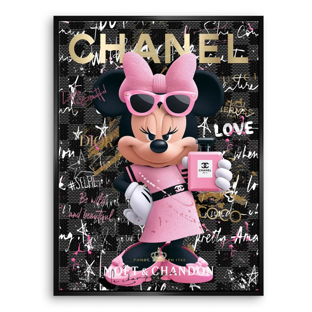 Bedroom decor featuring pink, black, and gold Minnie Mouse wall art.