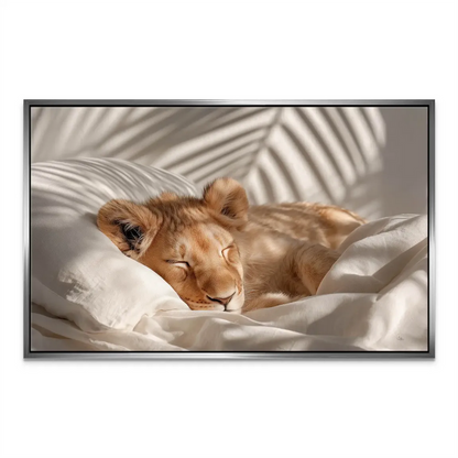 White bedding scene featuring a peacefully sleeping lion cub