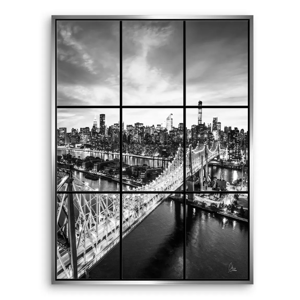 Dusk scene with bright city lights reflecting on the river behind the skyline.