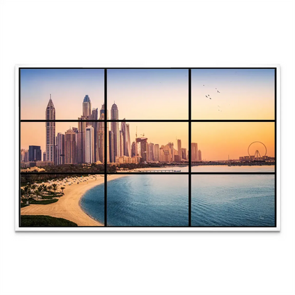 Warm sunset hues blending city architecture with natural coastal scenery