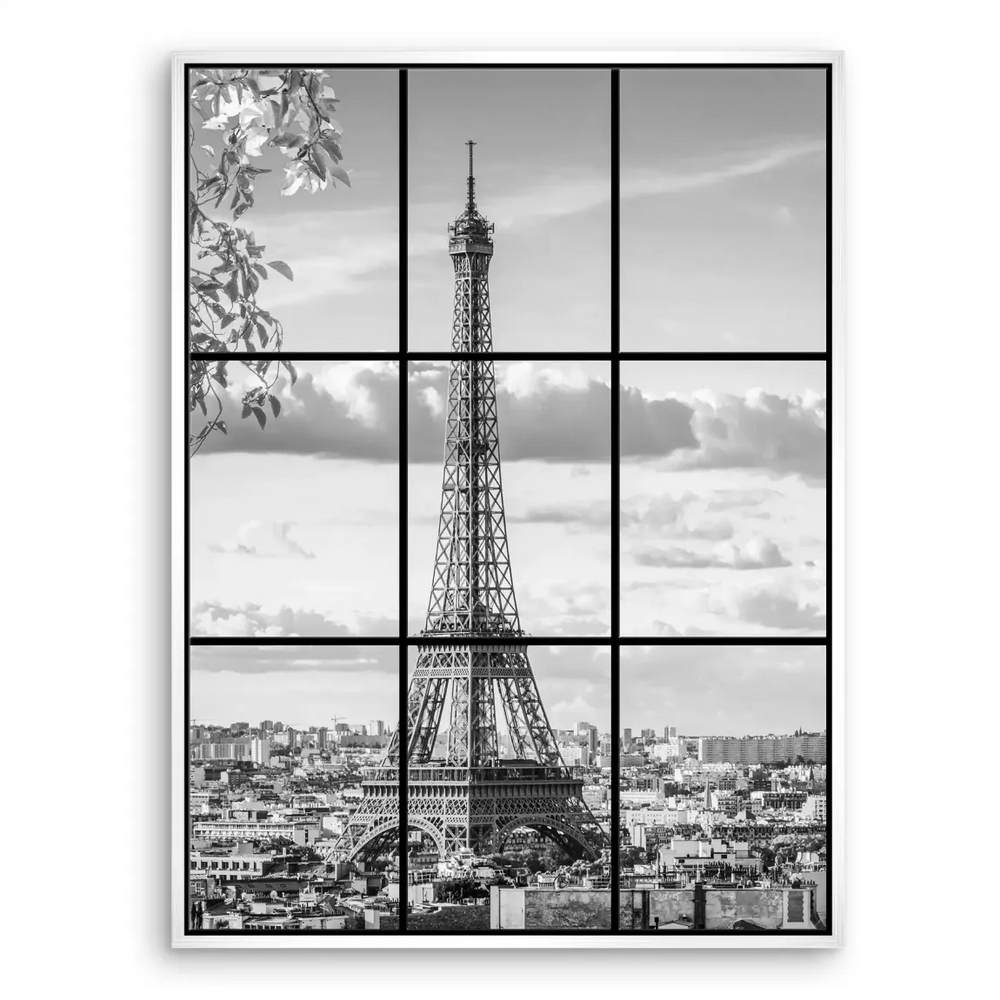 Lush foliage in the upper left corner against a Paris cityscape in grayscale.